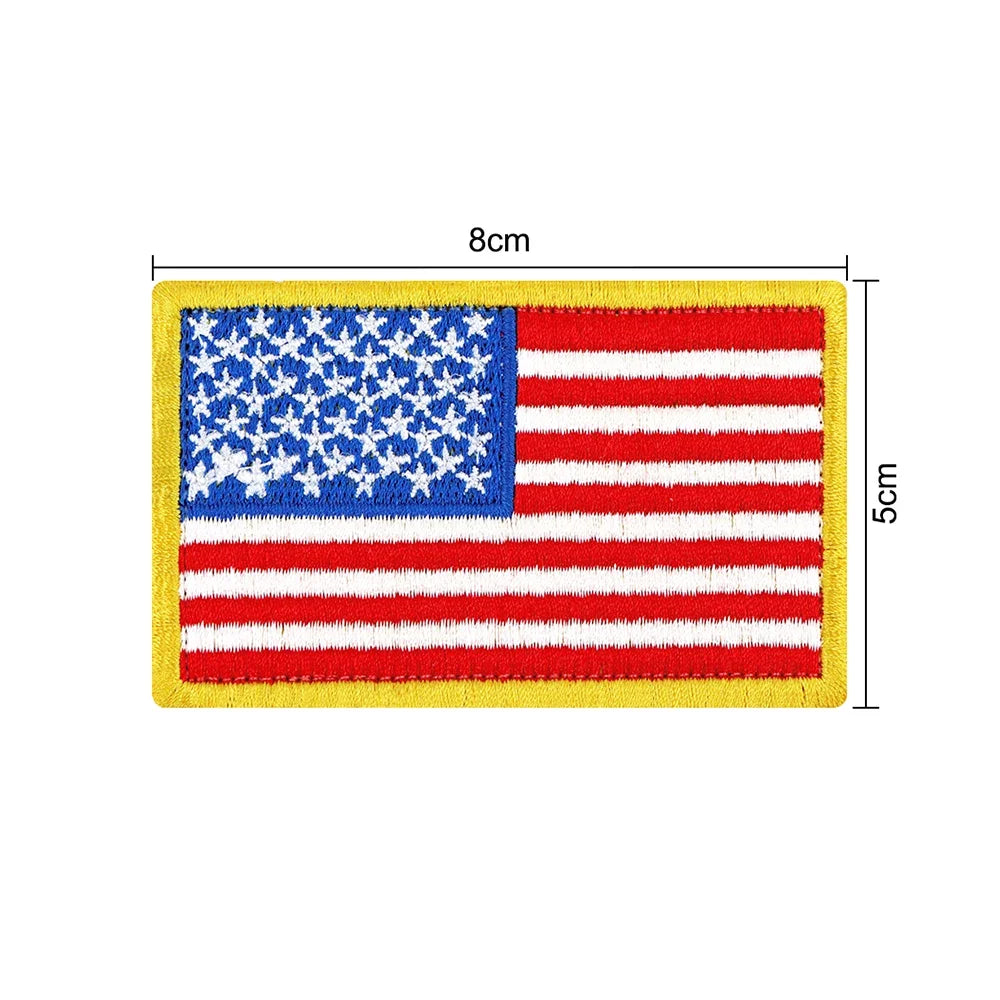 A rectangular patch featuring the American flag design with red and white stripes and blue stars on a yellow background.