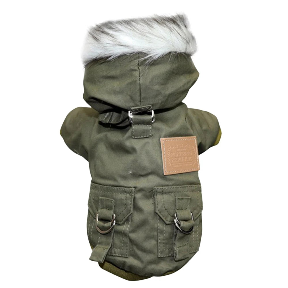 A olive green hooded winter jacket for a small dog with a white fur trim and leather patch.