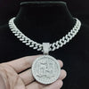 A silver iced out letter and animal pendant Cuban link chain necklace displayed on a black velvet display.
