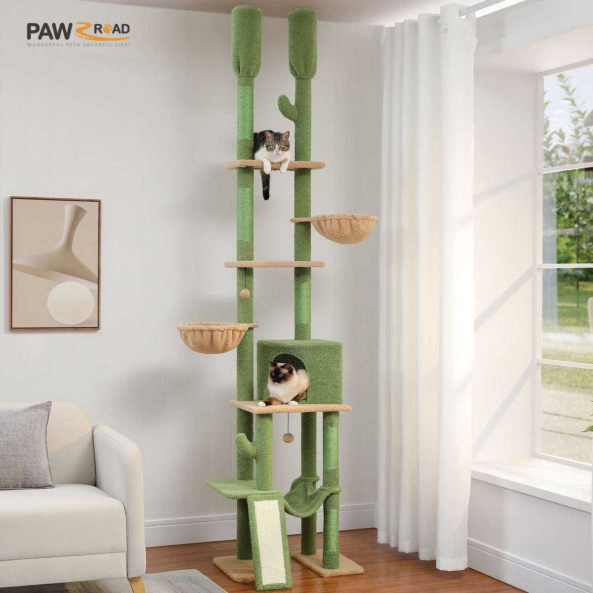 A floor-to-ceiling green cactus cat tree tower with multiple wooden hammocks and scratching posts in a bright room.