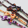 A set of Halloween cat collars featuring bow ties, various patterns, and safety buckles.