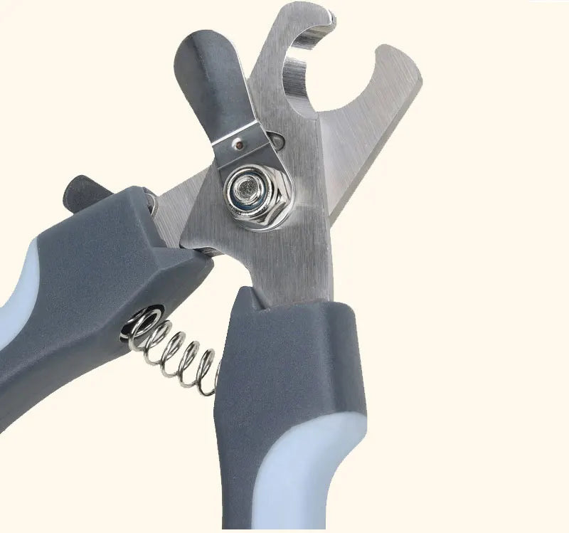 Stainless steel pet nail clippers with a gray handle and silver blades shown in a close-up view.