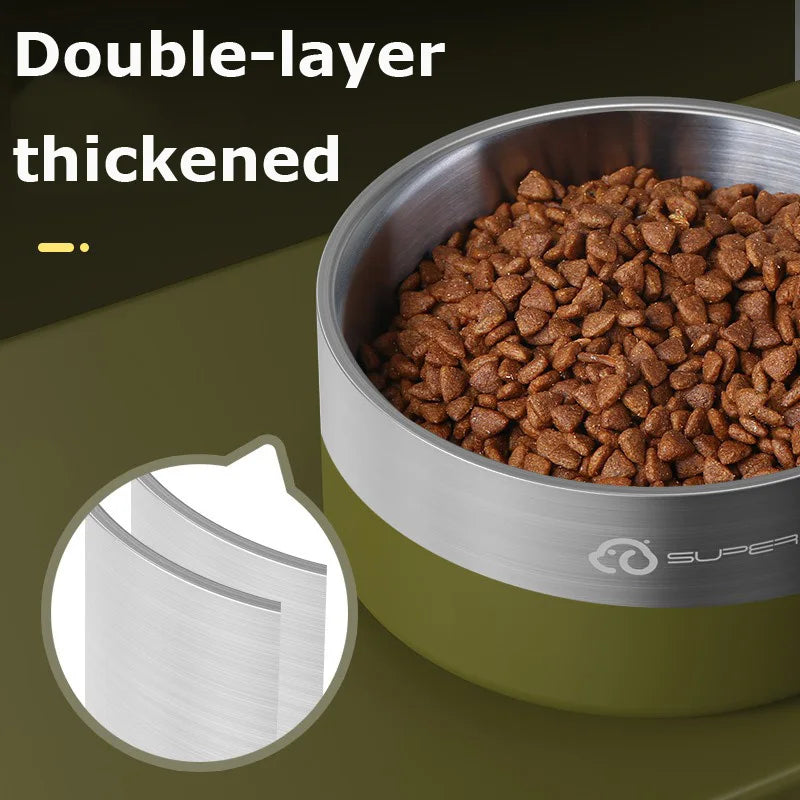 A close-up view of a double-layer thickened stainless steel dog bowl filled with dry kibble.