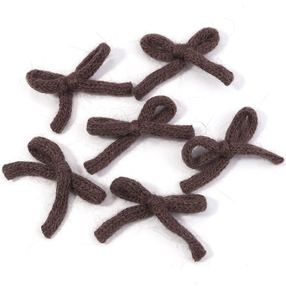 A set of six handmade knitted cotton bows in a dark brown color, double-layered bowknots for crafting.