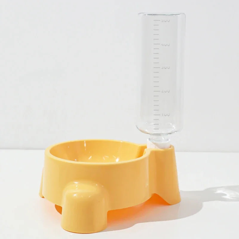 A yellow automatic pet water dispenser with a clear measuring tube is shown on a white surface.