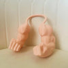 A pink 3D printed cat muscle arm accessory shaped like a hand and forearm.