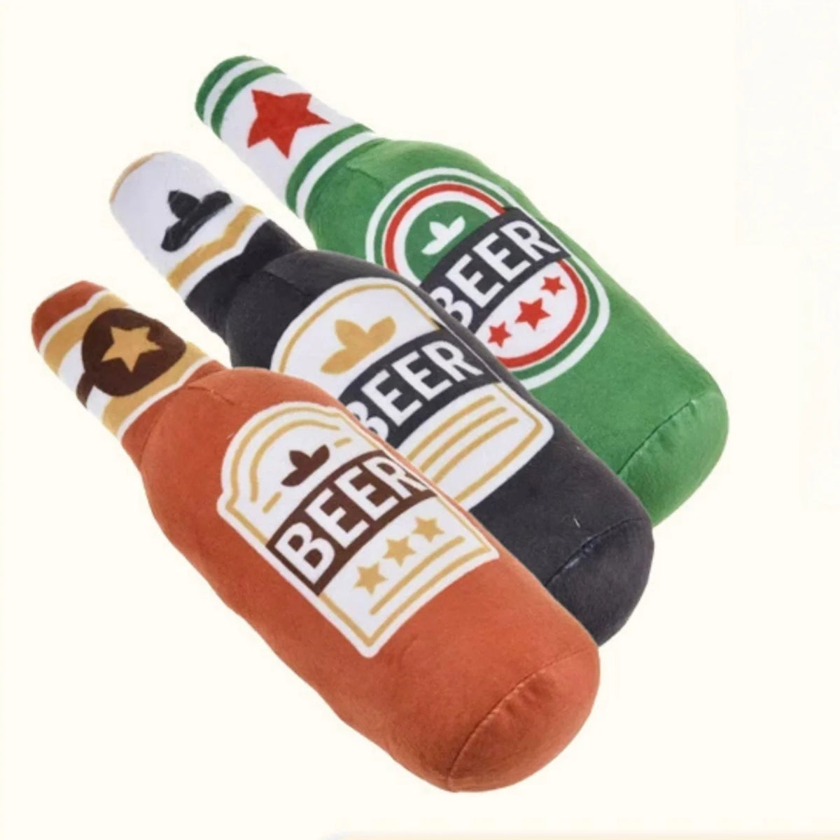 Three plush beer bottle shaped squeaky dog toys in green, black, and brown colors
