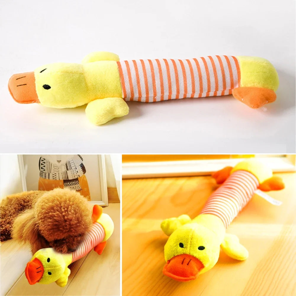 A yellow elephant fleece toy with orange accents, next to a striped duck and pig fleece toy.