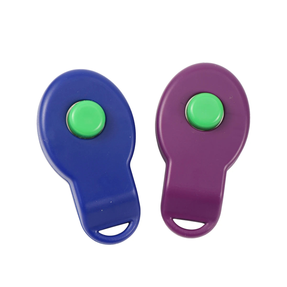 A pair of purple and blue dog training clickers with green buttons.