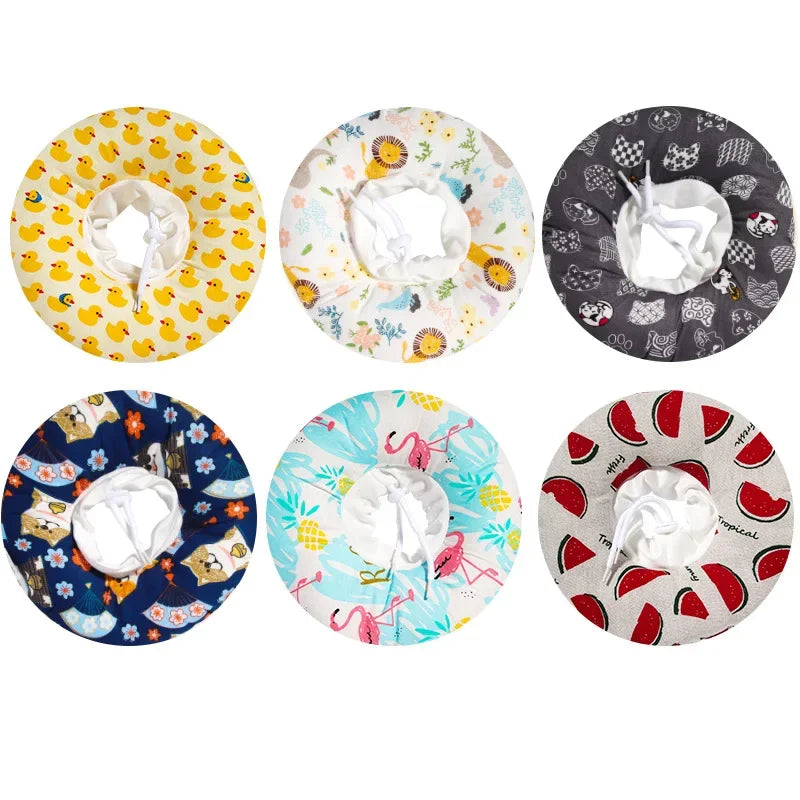 A set of nine colorful, patterned soft cotton recovery collars for dogs and cats with white adjustable collars.