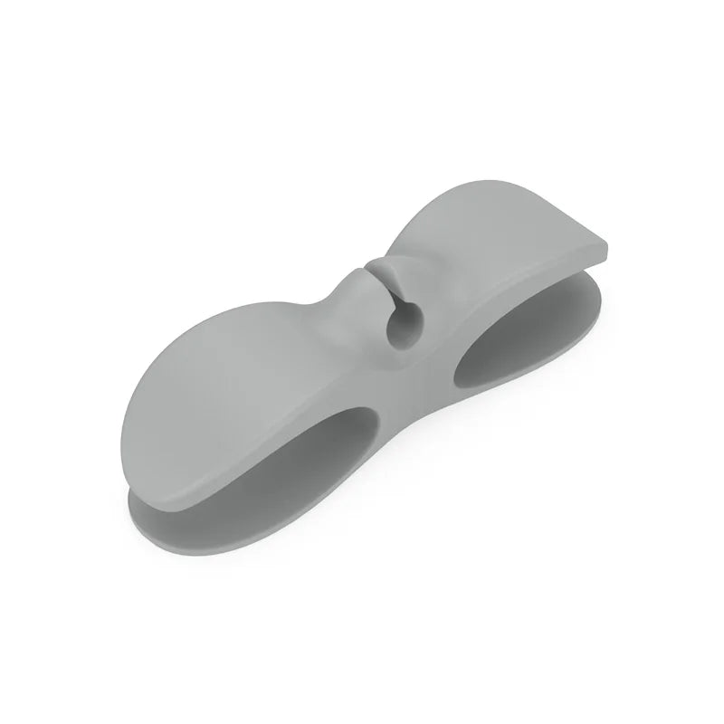 A gray heavy-duty silicone cable organizer designed to hold and manage household wires.