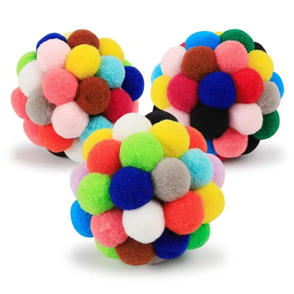 A ball toy made of colorful, fuzzy plush balls in various shades of pink, yellow, blue, green, and brown.