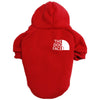 A red cozy fleece pet hoodie with a white dog face graphic on the back.