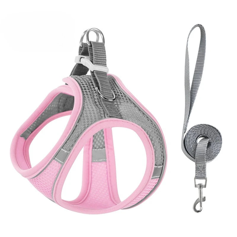 Pink reflective no-pull dog harness with a leash and hardware