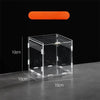 A clear acrylic reptile terrarium box with a solid orange lid and internal dots.