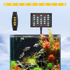 A black digital dimmer control device is shown above a glass aquarium filled with aquatic plants and fish.