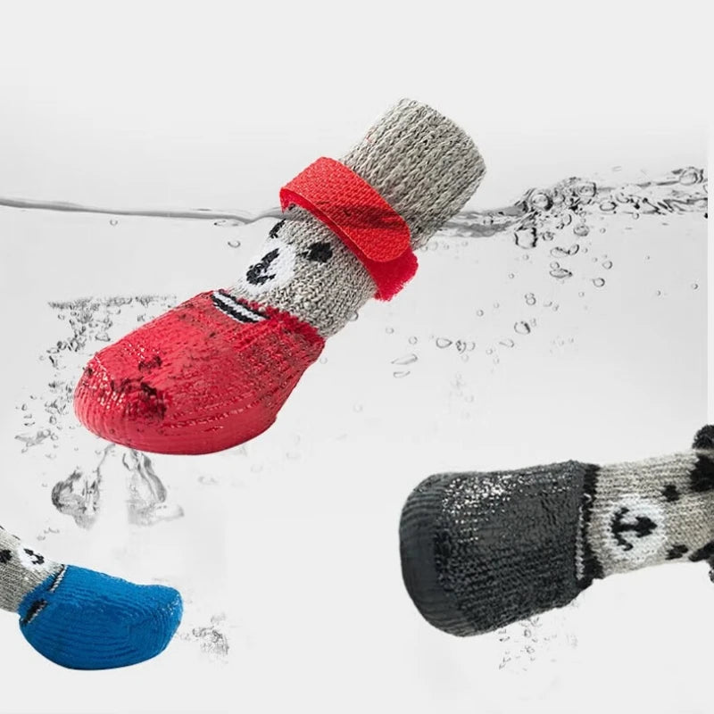 A red pet paw protection sock is shown submerged in water, with other socks visible below.