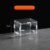 A clear acrylic reptile terrarium box with a lid and ventilation holes, shown on a dark surface.