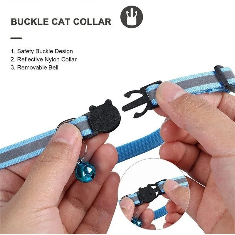 A hand is demonstrating a buckle cat collar with a reflective nylon collar and a removable bell.