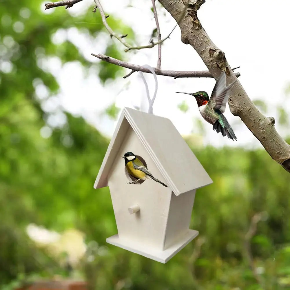 A white wooden wall-mounted bird house with a small bird perched on the entrance.