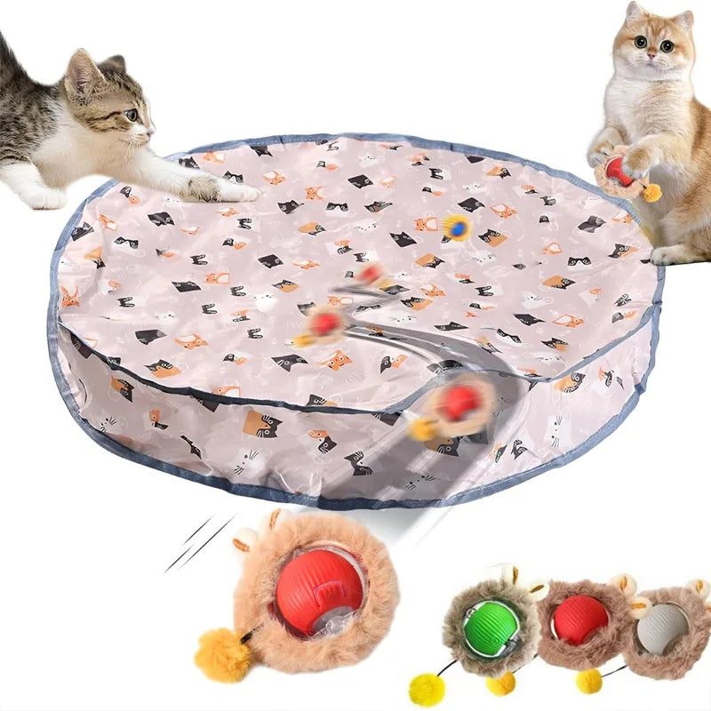 A motion-activated cat toy featuring a ball inside a pouch, shown next to a kitten and several plush toys.