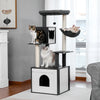 A wooden cat tower with a litter box enclosure and scratching posts is shown in a modern living room setting.
