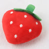 A bright red strawberry plush toy with green leaves and white dots.