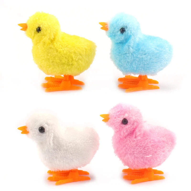Three plush chicks in yellow, blue, and pink with orange feet.