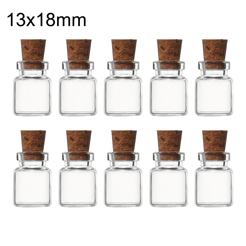 A set of 10 mini glass bottles with cork stoppers, packaged for sale.