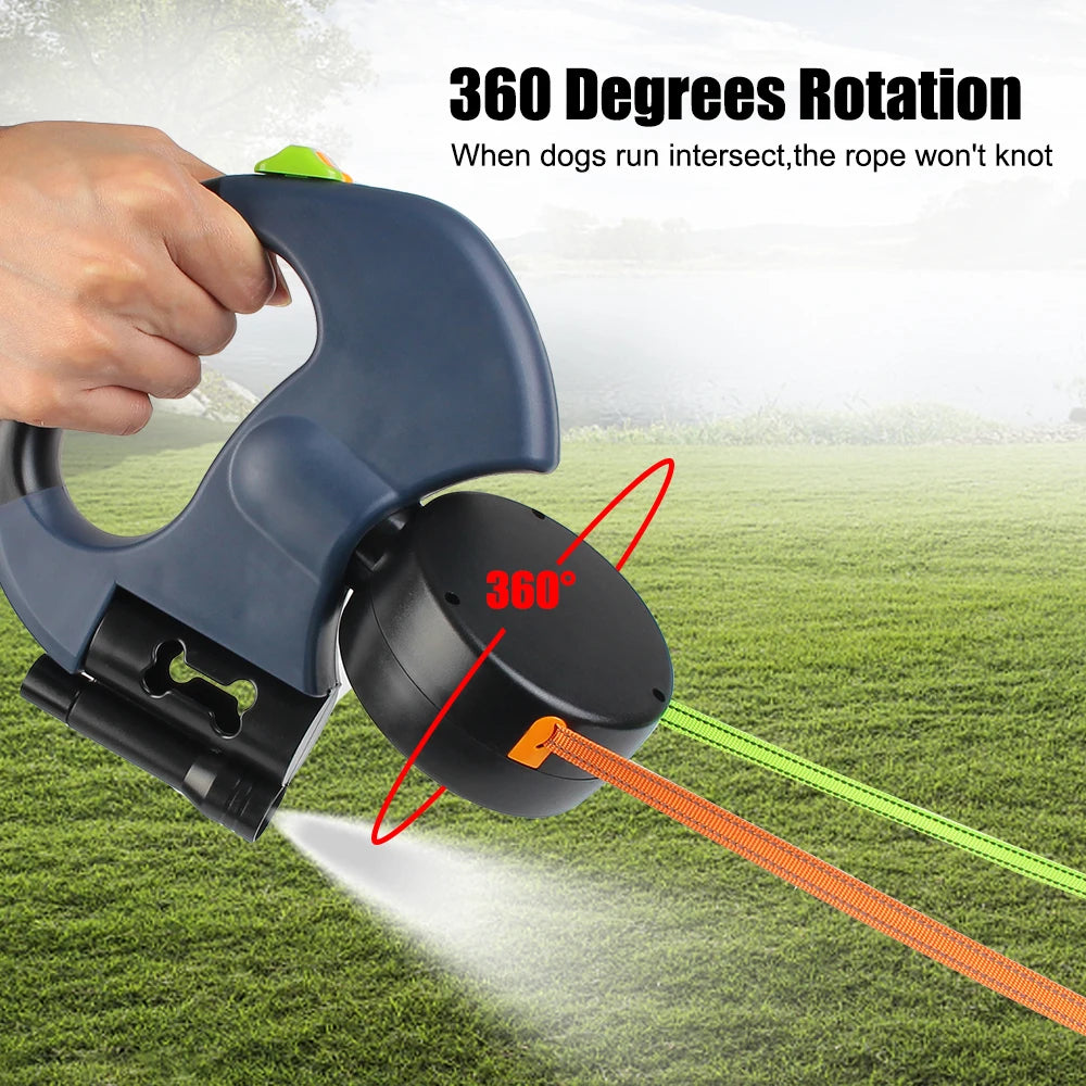 A hand is rotating a blue retractable dog leash with a 360-degree mechanism, showing the light and waste bag holder feature.