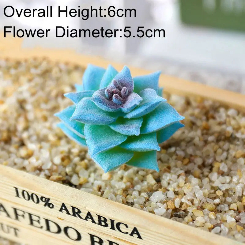 Blue artificial succulent plant with a flower diameter of 5.5cm placed on a wooden tray filled with sand.