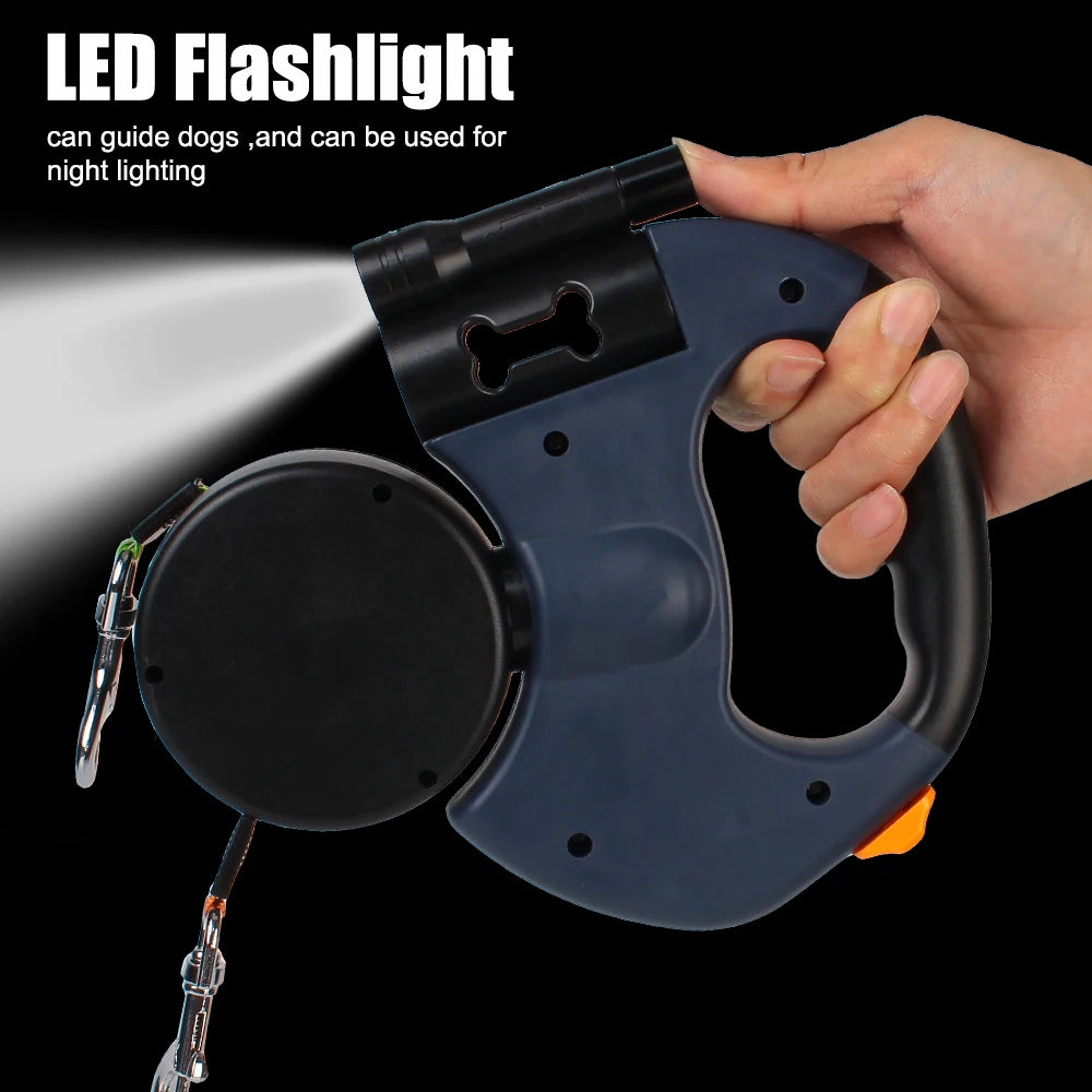 A hand holds a black LED flashlight attached to a leash, demonstrating its use for guiding dogs or night lighting.