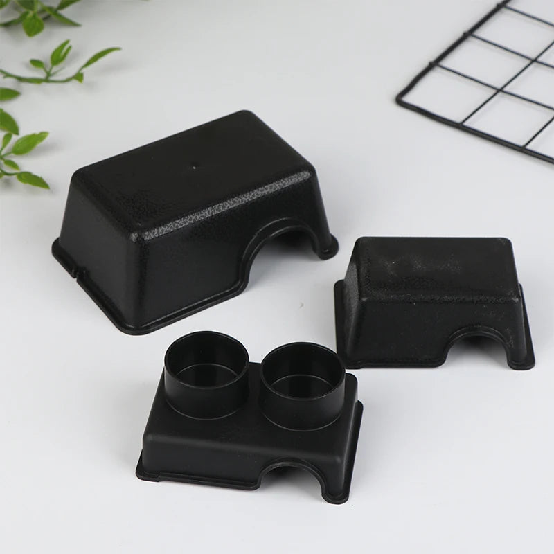 Black reptile hide box enclosure pieces shown on a white surface.