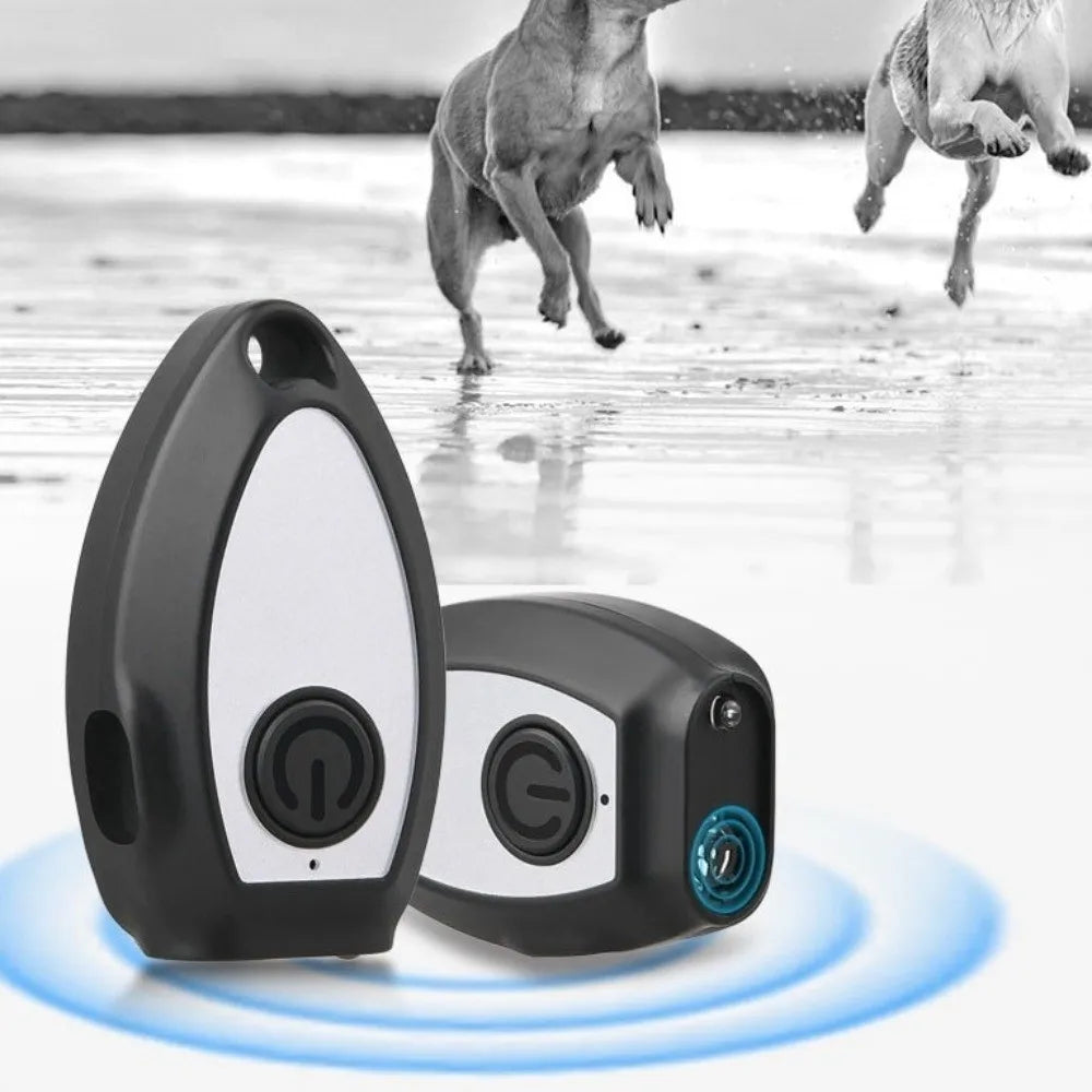 A black handheld ultrasonic dog bark deterrent device with an LED light is shown against a blurred background.