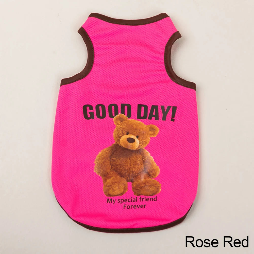 A bright pink pet vest featuring a cartoon bear print with the text Good Day My special friend Forever