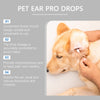 A close-up of a person applying pet ear drops to a dog's ear.