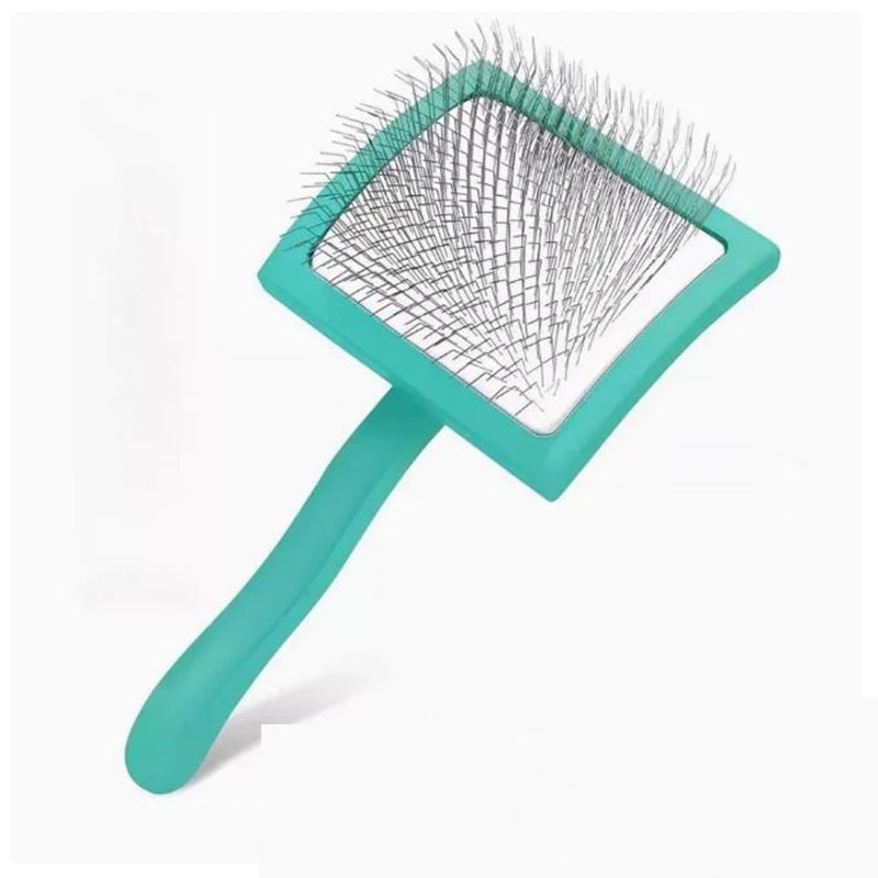 A teal ergonomic pet grooming rake with stainless steel teeth shown from above.