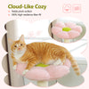 An orange tabby cat relaxing on a pink cloud-like cozy pet bed with a flower-shaped top perch.