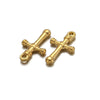 A pair of vintage gold-toned cross charms used for DIY jewelry making.