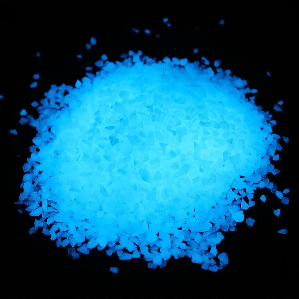 A pile of bright blue glow-in-the-dark decorative pebbles.