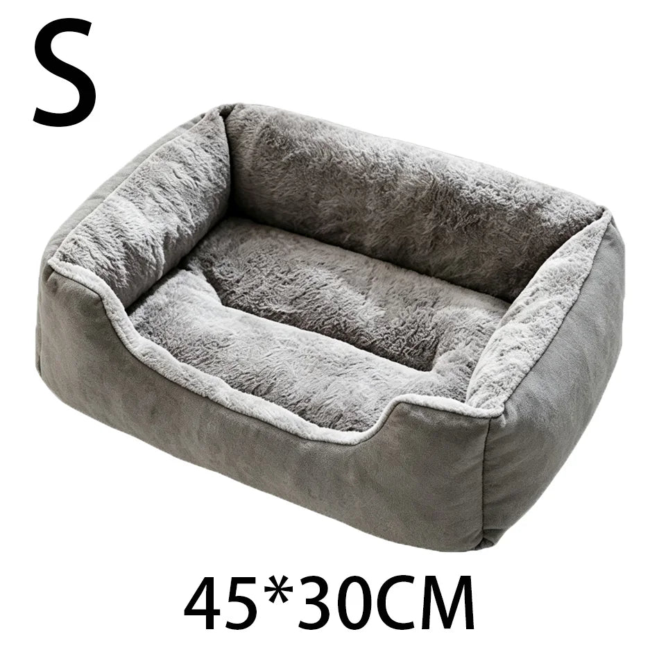 A gray plush pet bed with a rounded shape and anti-slip fabric is shown.