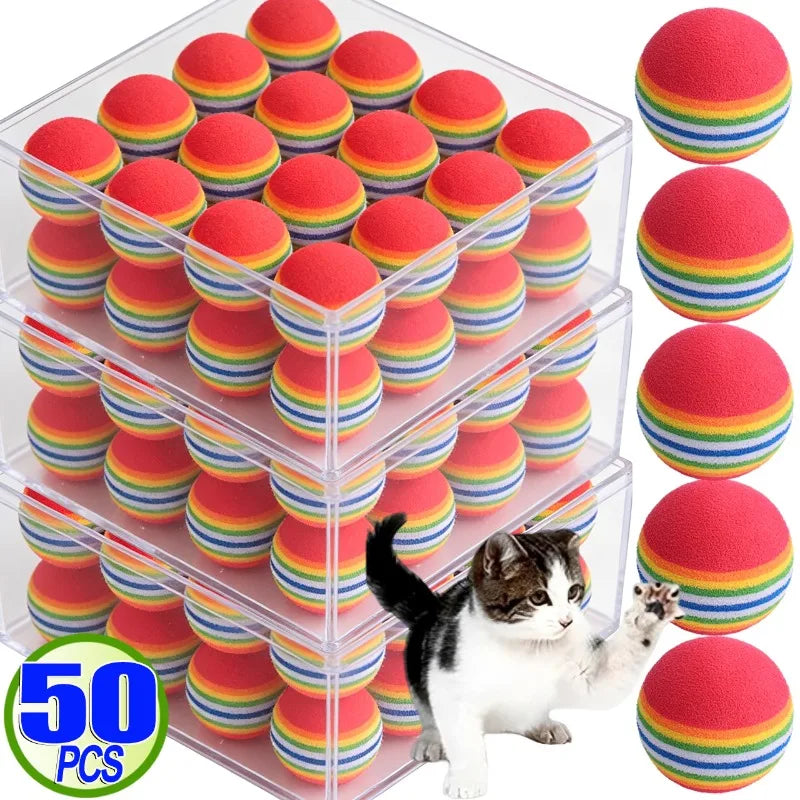 A clear container holds 50 rainbow colored EVA rattle balls for cats and small dogs.
