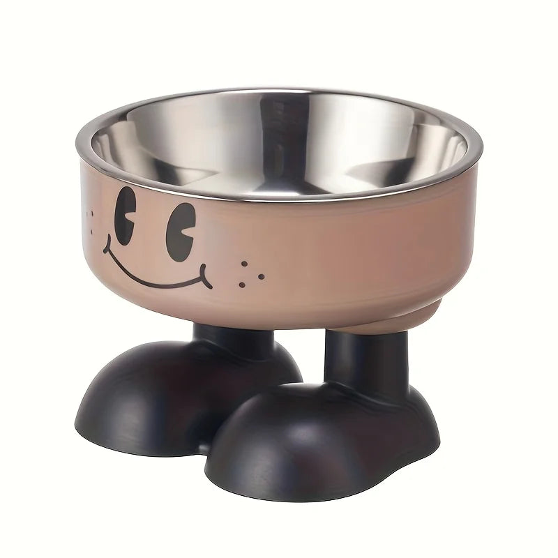 A stainless steel pet feeder shaped like a smiling face with a bowl and a base.