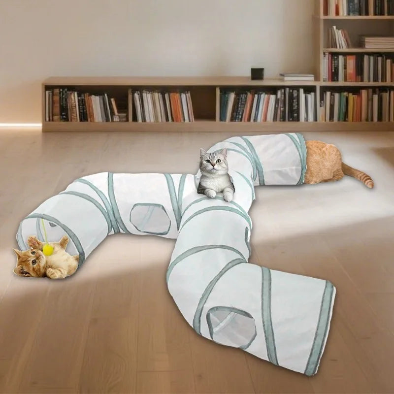 A light blue and white collapsible indoor play tunnel for cats lying on a wooden floor.