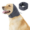 A golden retriever wearing a gray fabric hoodie and ear covers for anxiety relief.