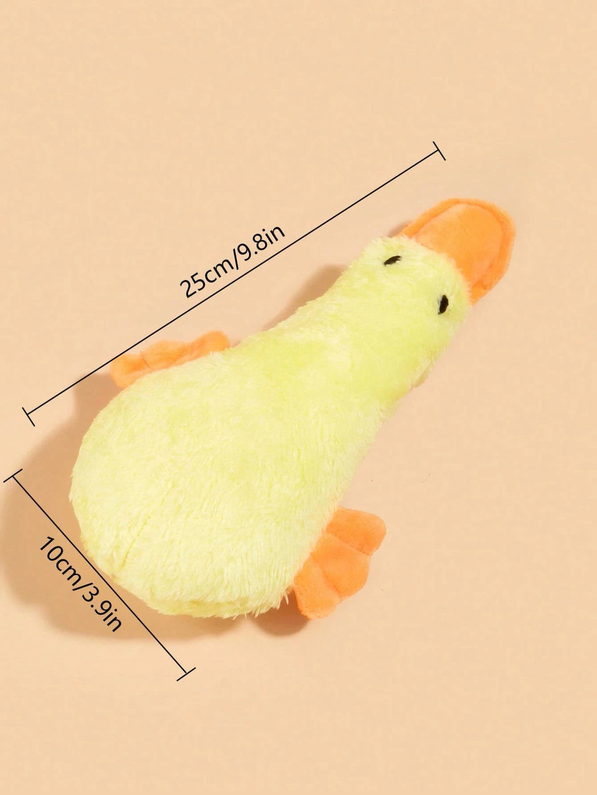 A yellow plush duck toy with orange accents, shown from above with dimension lines.