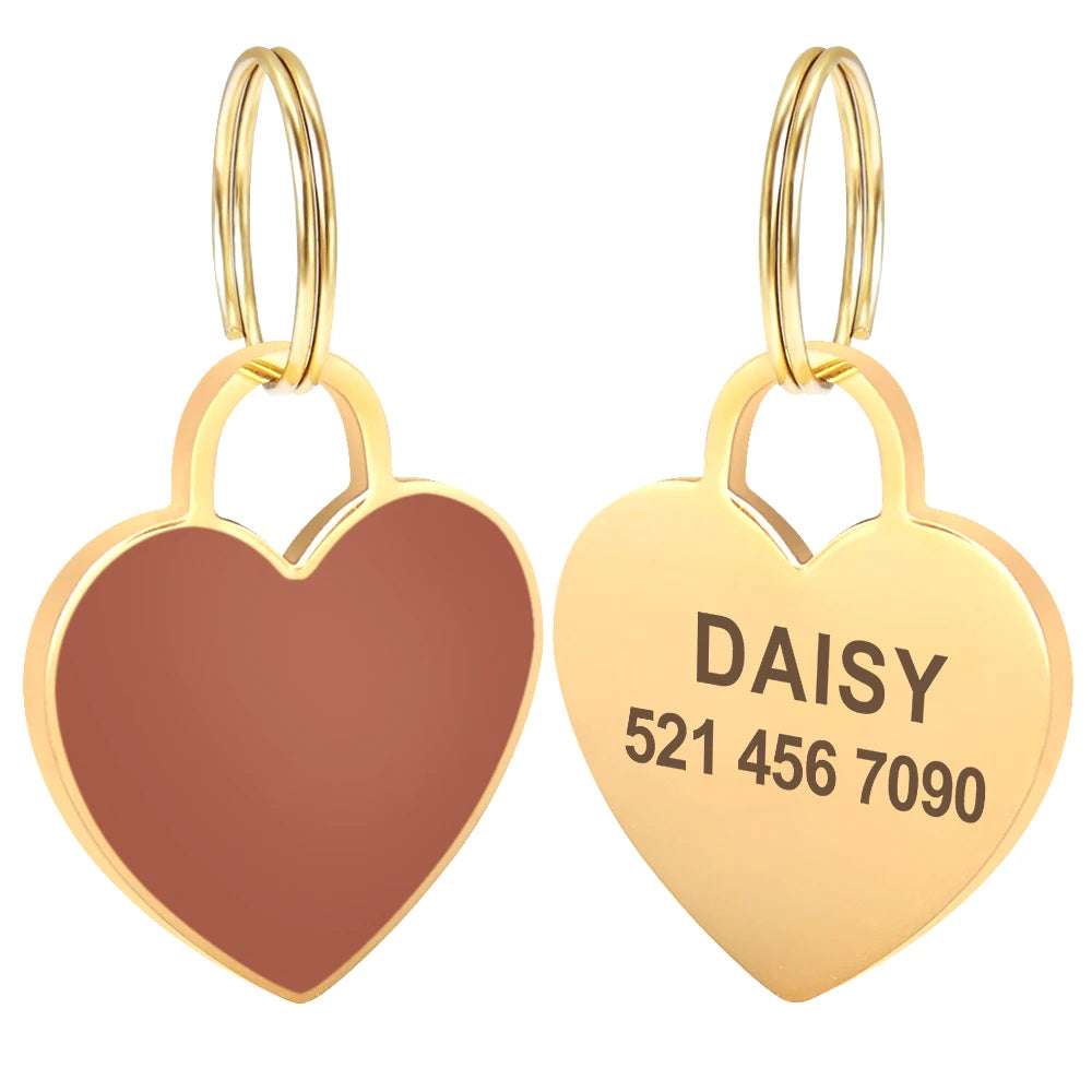 Gold heart-shaped pet ID tag with the name Daisy and phone number 5214567090