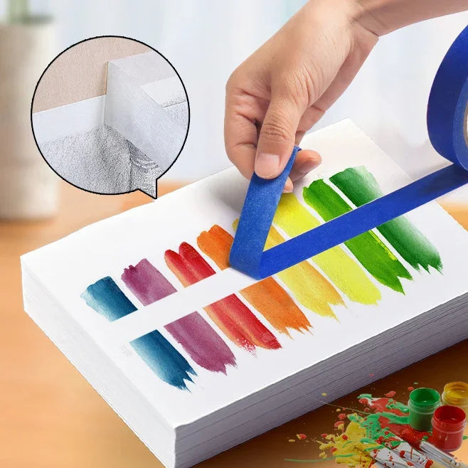 A hand applies orange multi-surface masking tape to a sheet of paper, showing various colors and texture options.