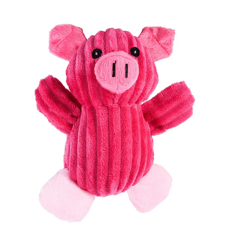 A pink plush toy shaped like a pig with floppy ears and pink feet.