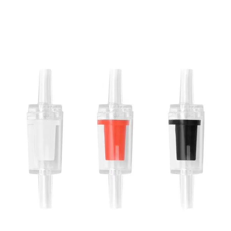 A set of clear plastic aquarium air pump check valves with colored internal components.
